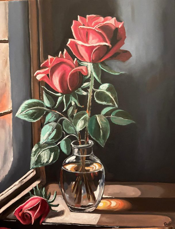 Two Roses at Dusk by Deepti Dasika: Classical still life: two red roses in a glass vase on a windowsill, a fallen bud and book, warm light against a dark wall.